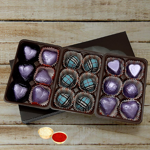 Mouthwatering Pack of 18pcs Assorted Homemade Chocolate. with free Roli Tilak and Chawal. Mouthwatering Pack of 18pcs Assorted Homemade Chocolate. with free Roli Tilak and Chawal.