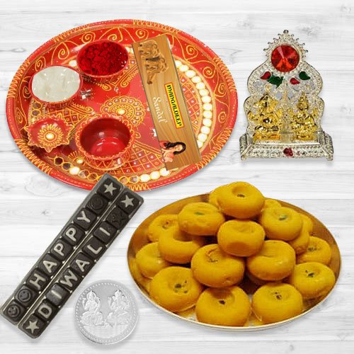 Pooja Samagri Hamper with Peda and Chocolate with free silver plated coin for Diwali. Pooja Samagri Hamper with Peda and Chocolate with free silver plated coin for Diwali.