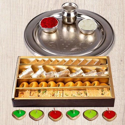 Silver Puja Thali Diya N Haldirams Assorted Sweets. Silver Puja Thali Diya N Haldirams Assorted Sweets.