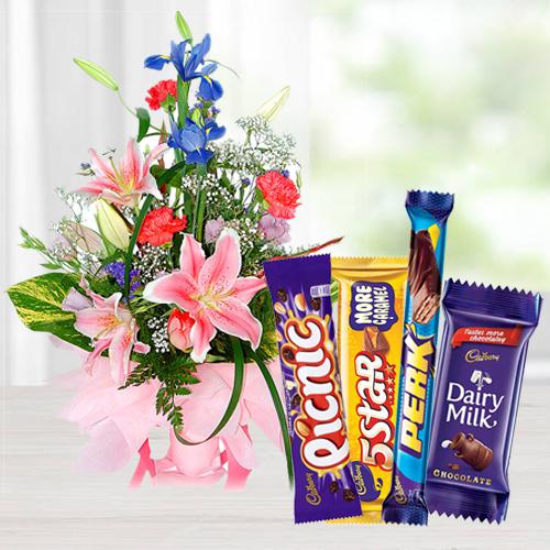 Seasonal Flowers Arrangement with Assorted Cadbury Chocolates Seasonal Flowers Arrangement with Assorted Cadbury Chocolates