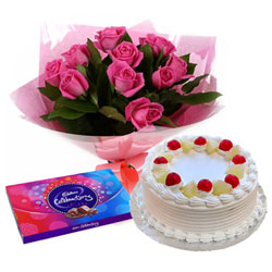 Tasty Cadbury Celebration with Cake and Pink Rose Bouquet