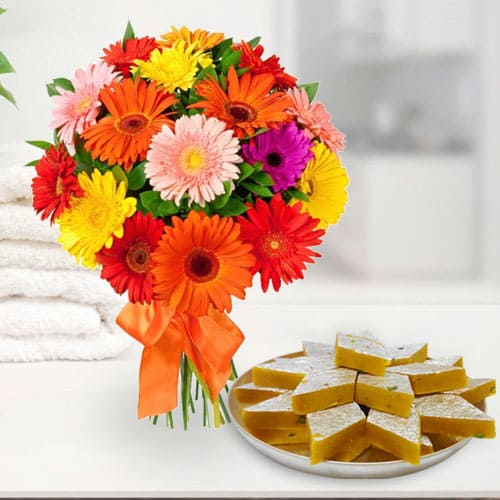Radiant Mixed Gerberas Arrangement with Kaju Katli Radiant Mixed Gerberas Arrangement with Kaju Katli