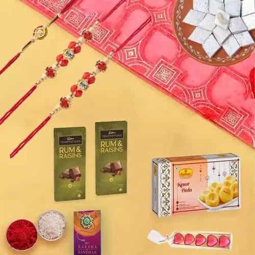 Sweets N Savory Combo with Dual Rakhis Sweets N Savory Combo with Dual Rakhis