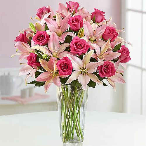 Delicate Roses N Lilies in a Glass Vase	