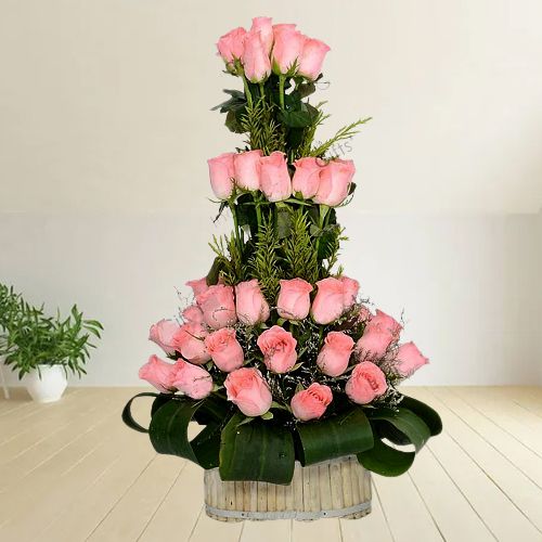 Brilliant Pink Roses Basket decked with Leaves