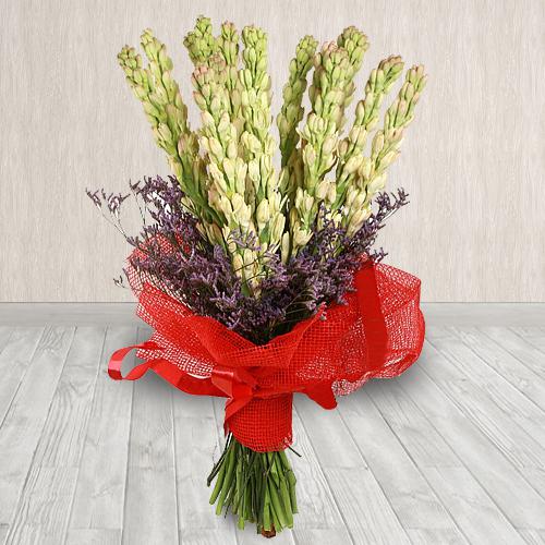 Elegant Hand Designed Bouquet of Rajnigandha in Tissue Wrapping