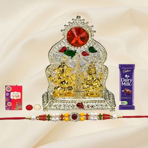 Silver Plated Mandap with Golden Ganesh Laxmi Idol and Cadbury Dairy Milk Chocolate with Rakhi and Roli Tilak Chawal