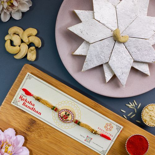 Holy Ganesha Rakhi N Kaju Katli Combo Holy Ganesha Rakhi N Kaju Katli Combo