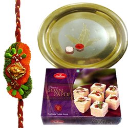 Traditional Combo Gift of Gold Plated Thali and Tasty Haldiram Soan Papri with Free Rakhi Roli Tilak and Chawal Traditional Combo Gift of Gold Plated Thali and Tasty Haldiram Soan Papri with Free Rakhi Roli Tilak and Chawal