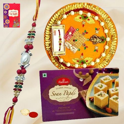 Delicious Pack of Rakhi Special Soan Papri from Haldiram and Thali along with Rakhi Roli Tilak and Chawal Delicious Pack of Rakhi Special Soan Papri from Haldiram and Thali along with Rakhi Roli Tilak and Chawal