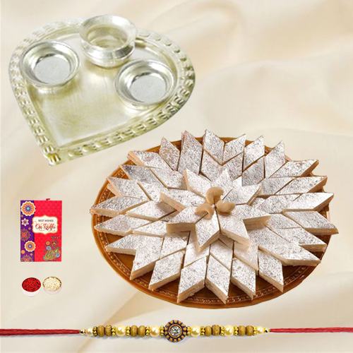 Irresistible Kaju Katli from Haldiram and Fancy Silver Plated Paan Shaped Puja Aarti Thali with Rakhi Roli Tilak and Chawal for your Loving Brother Irresistible Kaju Katli from Haldiram and Fancy Silver Plated Paan Shaped Puja Aarti Thali with Rakhi Roli Tilak and Chawal for your Loving Brother