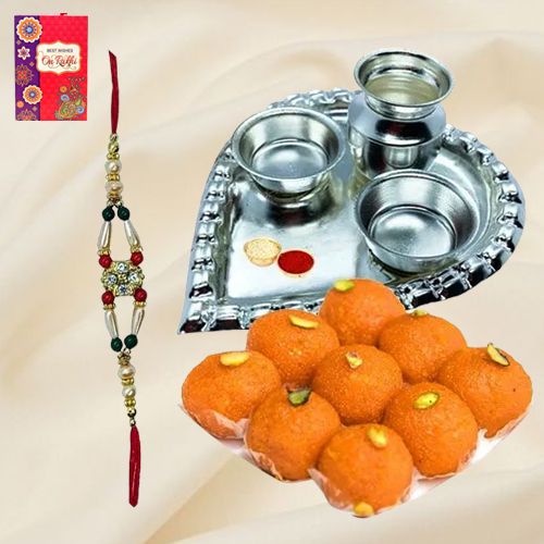 Laddoo from Haldiram and Silver Plated Paan Shaped Puja Aarti Thali along with Rakhi Laddoo from Haldiram and Silver Plated Paan Shaped Puja Aarti Thali along with Rakhi