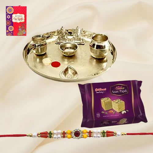 Soan Papri from Haldiram and Silver Plated Paan Shaped Puja Aarti Thali along with Rakhi Soan Papri from Haldiram and Silver Plated Paan Shaped Puja Aarti Thali along with Rakhi