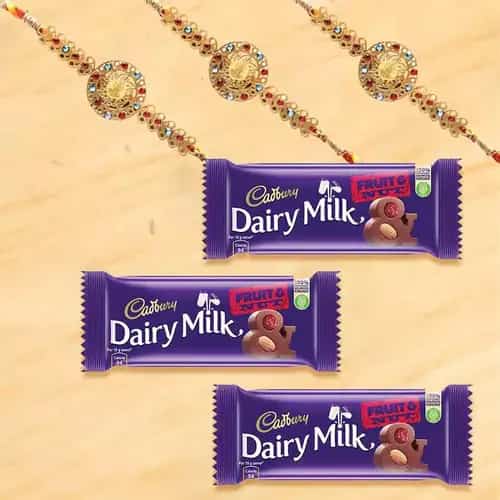 Arresting Rakhi with Cadbury Fruit n Nut Chocolates Bar Trio Arresting Rakhi with Cadbury Fruit n Nut Chocolates Bar Trio