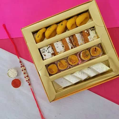 Arresting Stone Rakhi with Assorted Sweets