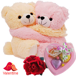 Cute Hugging Couple Teddy with 1 Velvet Rose and 3 pcs Heart Homemade Chocolate Cute Hugging Couple Teddy with 1 Velvet Rose and 3 pcs Heart Homemade Chocolate