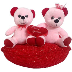 Excellent Two Teddy Bears Sitting on Red Cushion Excellent Two Teddy Bears Sitting on Red Cushion